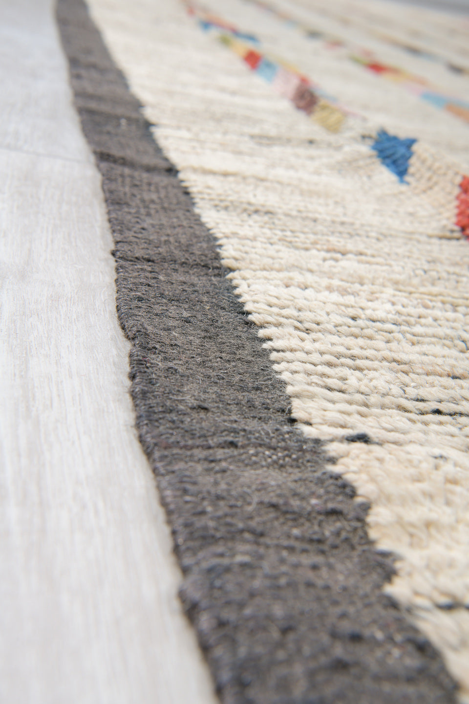10' x 13' one-of-a-kind handmade vintage Tulu large size rug. Color palette: ivory, charcoal, coral, cobalt, peach, gold