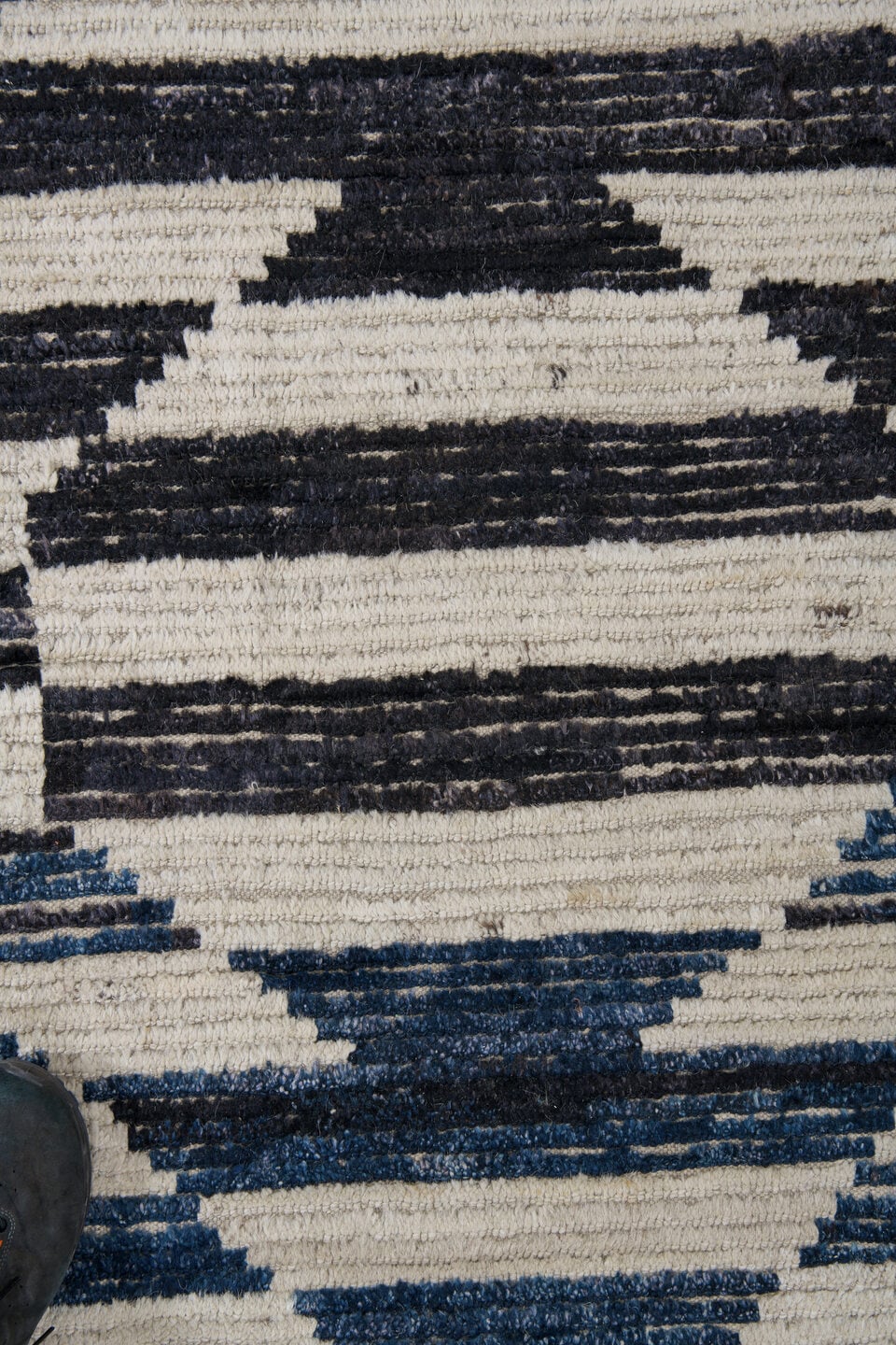 9' x 12' one-of-a-kind handmade vintage Tulu large size rug. Color palette: ivory, indigo, charcoal, black, purple, gray
