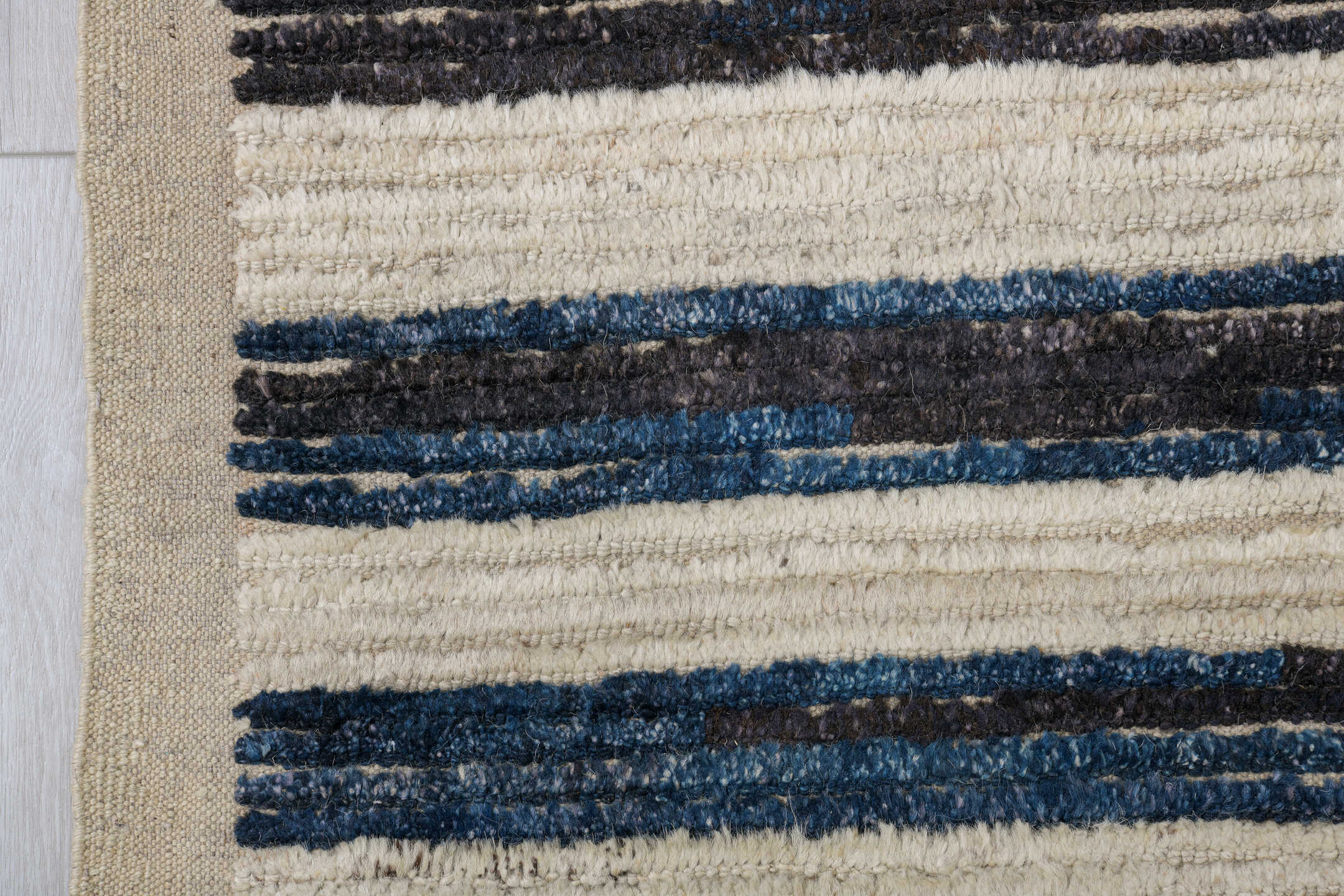 9' x 12' one-of-a-kind handmade vintage Tulu large size rug. Color palette: ivory, indigo, charcoal, black, purple, gray