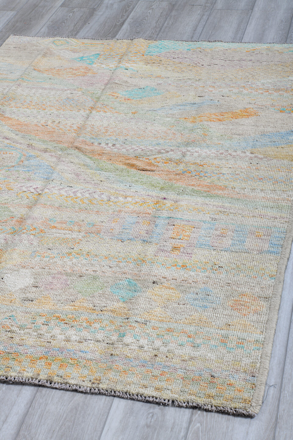 4' x 6' one-of-a-kind handmade vintage Tulu small size rug. Color palette: ivory, pale aqua, apricot, sage, lavender, taupe