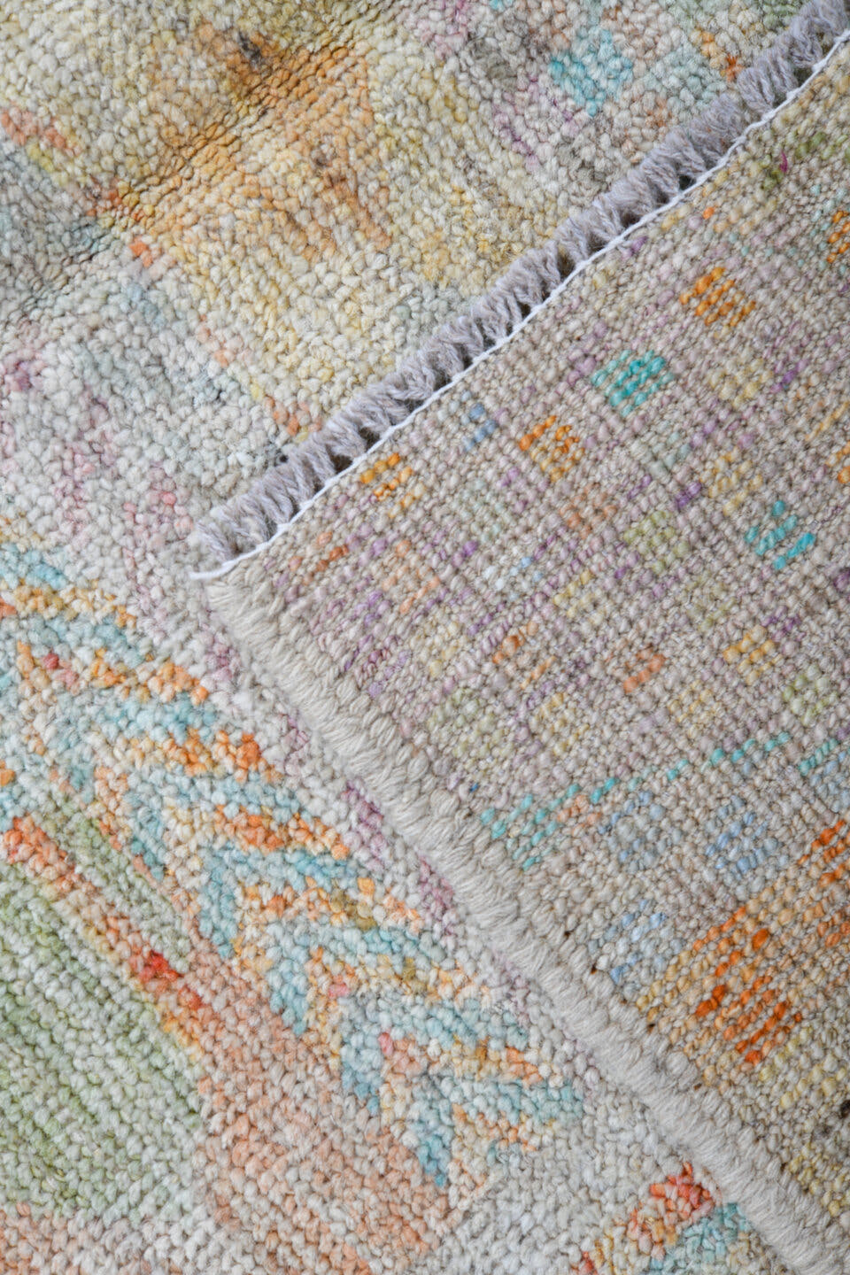 4' x 6' one-of-a-kind handmade vintage Tulu small size rug. Color palette: ivory, pale aqua, apricot, sage, lavender, taupe