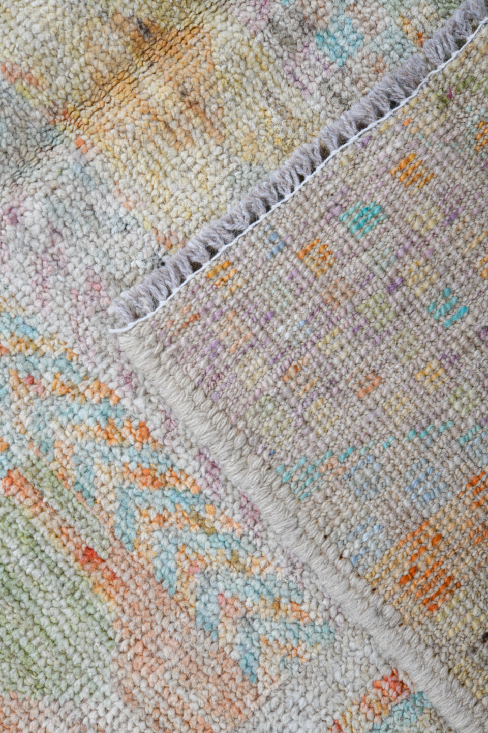 4' x 6' one-of-a-kind handmade vintage Tulu small size rug. Color palette: ivory, pale aqua, apricot, sage, lavender, taupe