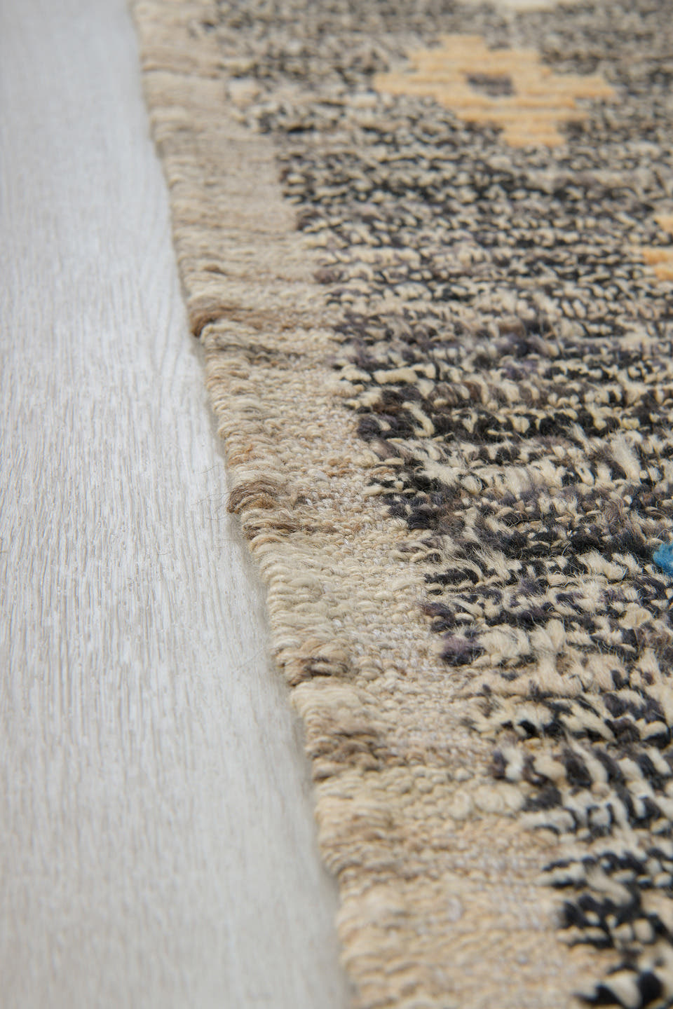 3' x 11' one-of-a-kind handmade vintage Tulu runner rug. Color palette: charcoal, ivory, blue, cream, peach, gray, black