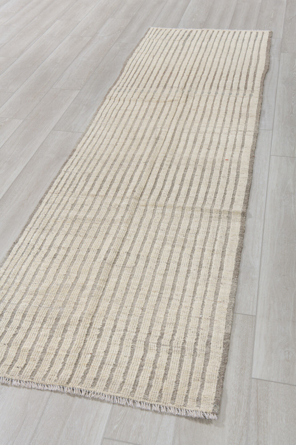 2' x 9' one-of-a-kind handmade vintage Tulu runner rug. Color palette: ivory, taupe, gray, cream, beige