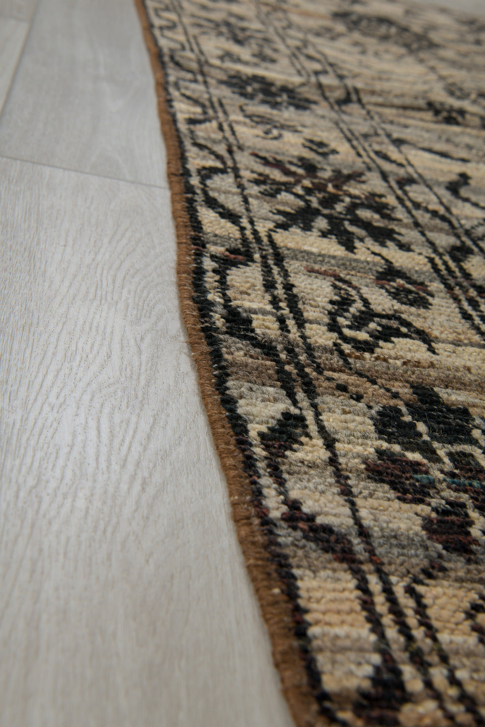 2' x 9' one-of-a-kind handmade vintage Tulu runner rug. Color palette: ivory, charcoal, taupe, brown, burgundy, black, gray