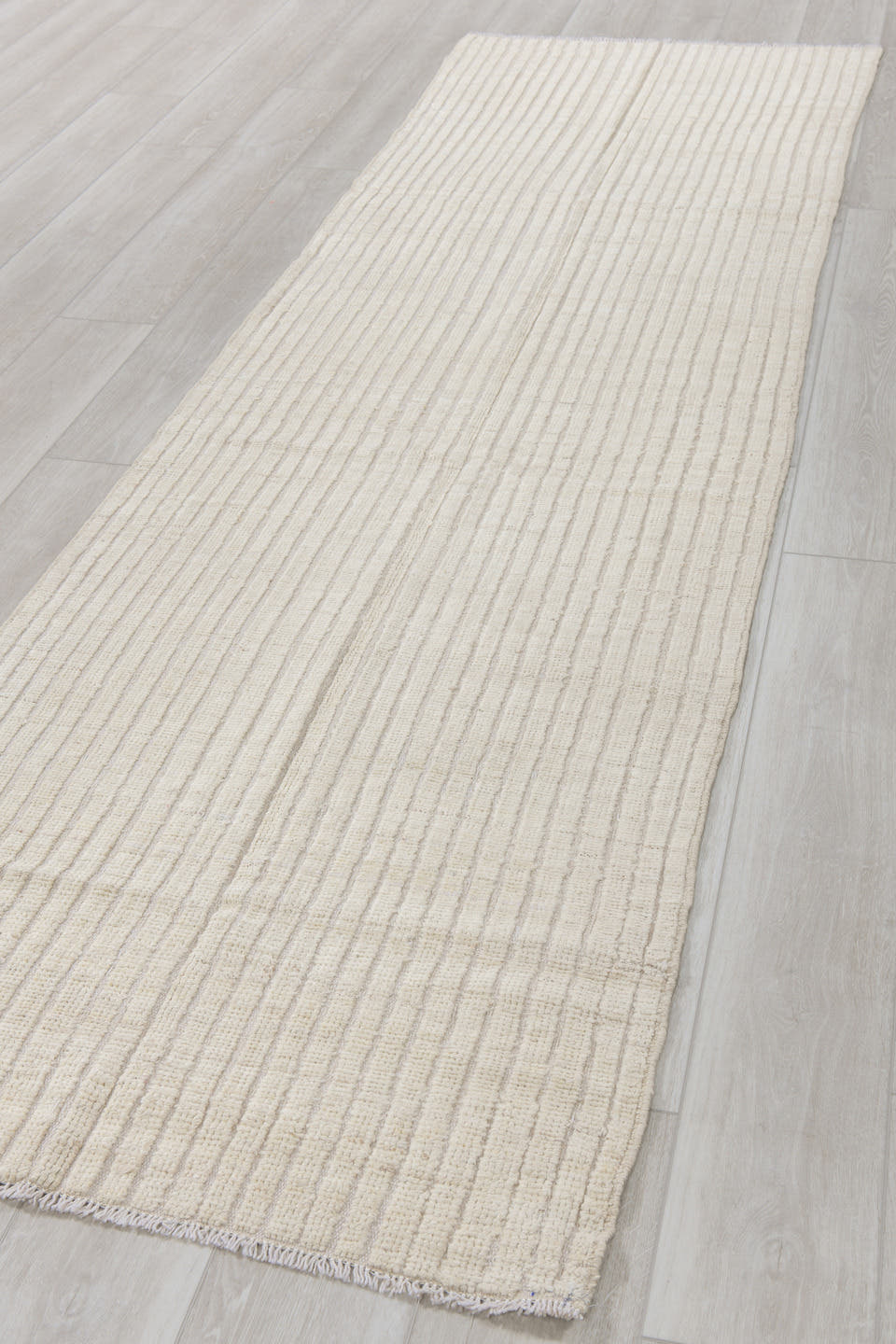 3' x 11' one-of-a-kind handmade vintage Tulu runner rug. Color palette: ivory, cream, beige