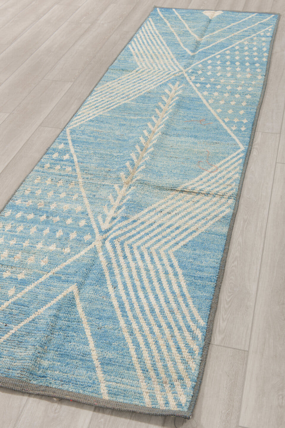 2' x 9' one-of-a-kind handmade vintage Tulu runner rug. Color palette: sky blue, ivory, slate, light blue, gray