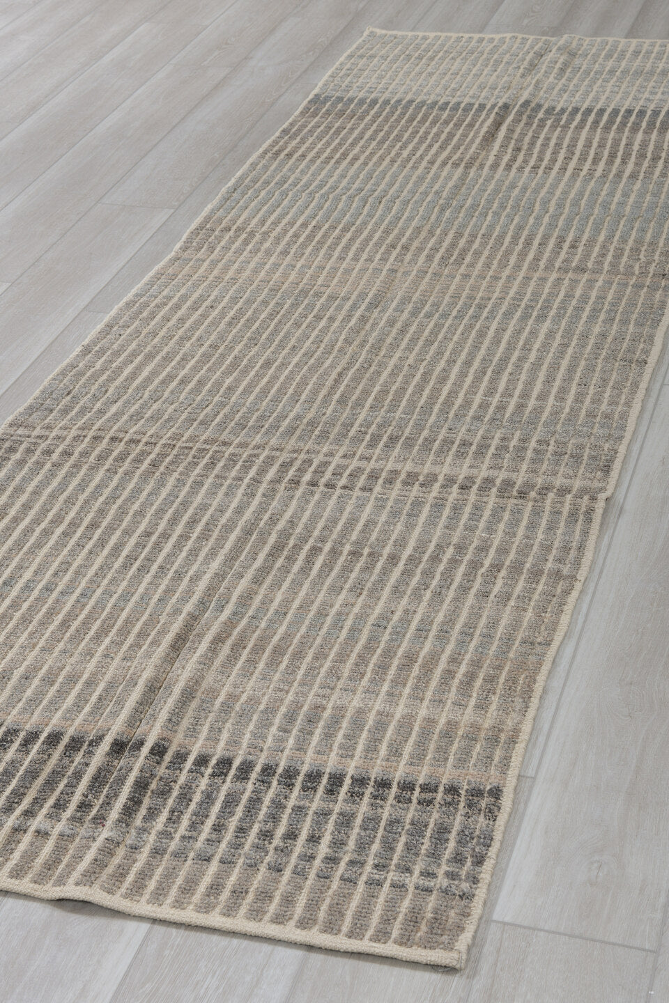 3' x 9' one-of-a-kind handmade vintage Tulu runner rug. Color palette: ivory, charcoal, taupe, gray, black, beige