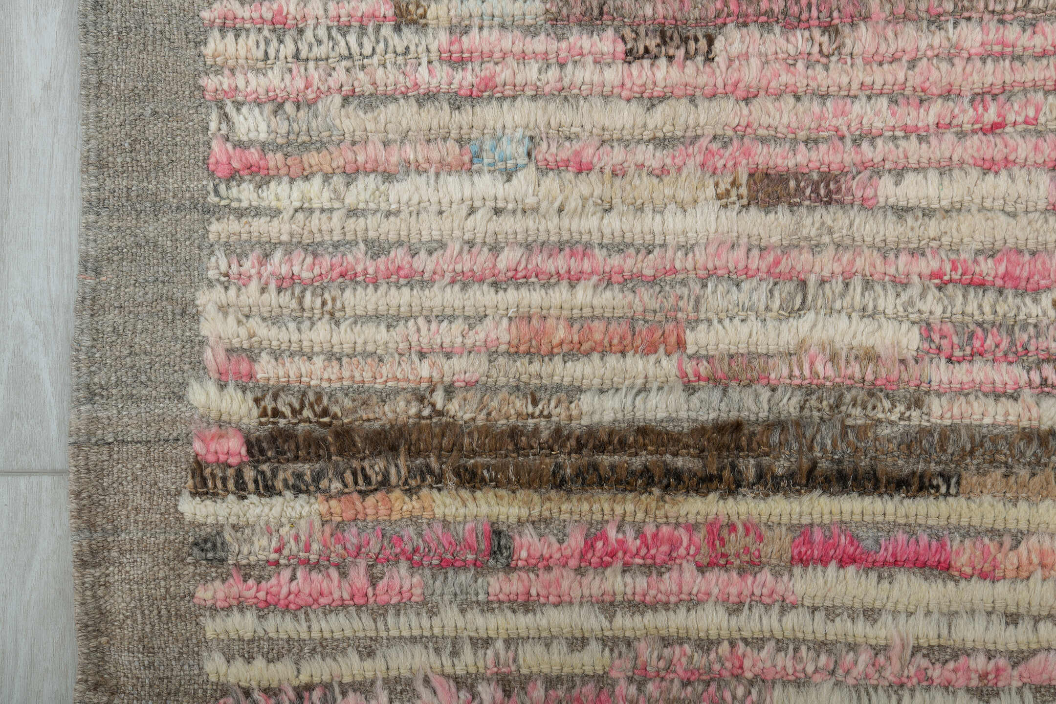 3' x 9' one-of-a-kind handmade vintage Tulu runner rug. Color palette: brown, gray, light gray, off-white, pink, red