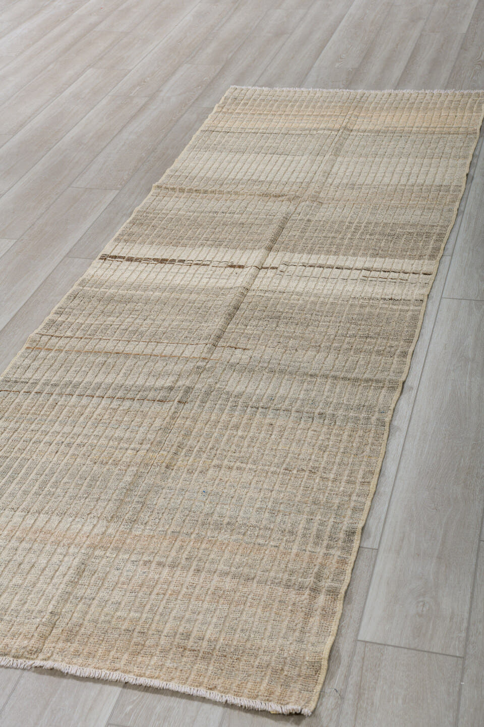 3' x 9' one-of-a-kind handmade vintage Tulu runner rug. Color palette: ivory, taupe, gray, brown, cream, beige
