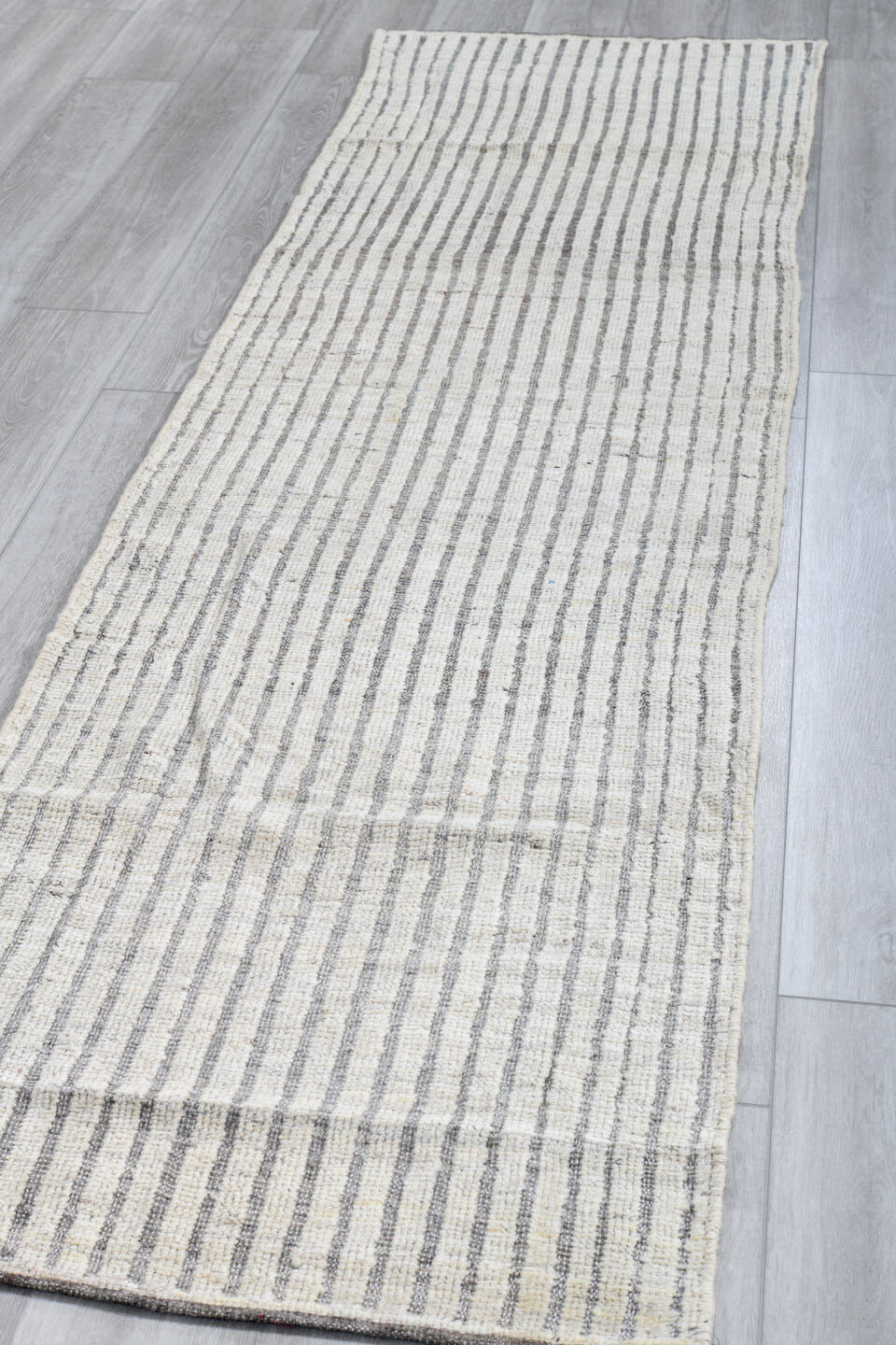 2' x 9' one-of-a-kind handmade vintage Tulu runner rug. Color palette: ivory, gray, taupe, beige