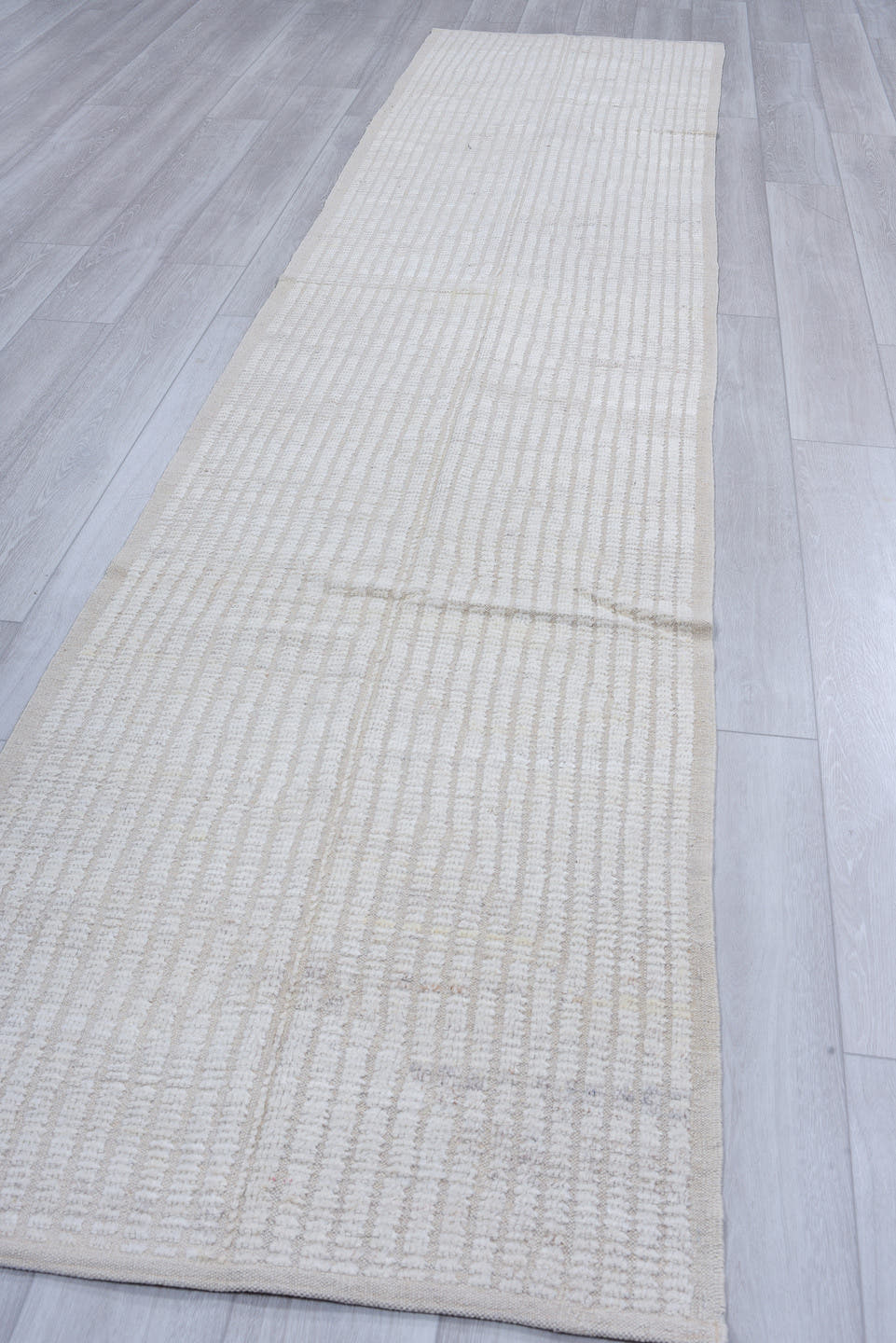 3' x 12' one-of-a-kind handmade vintage Tulu runner rug. Color palette: ivory, cream, light gray