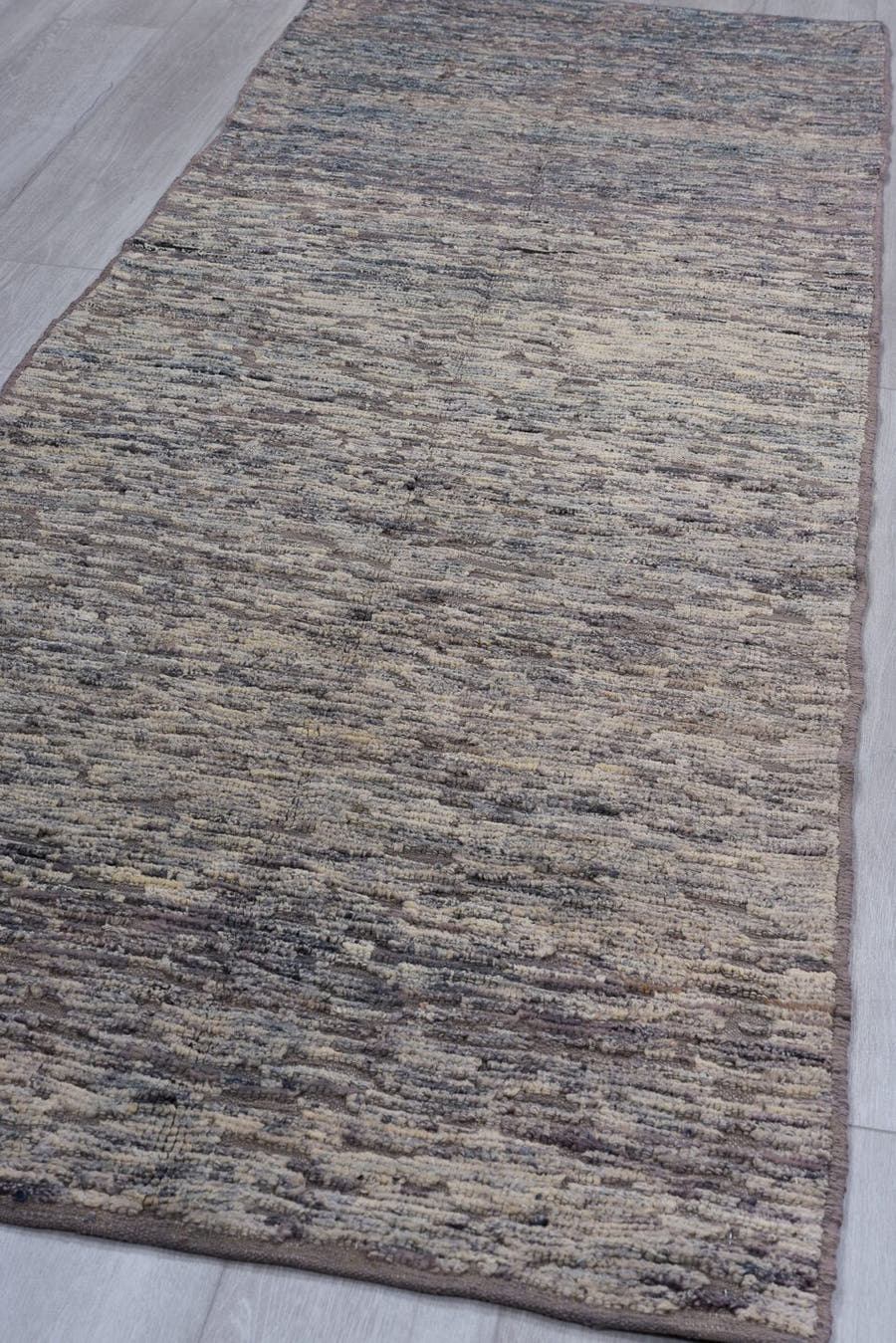 3' x 9' one-of-a-kind handmade vintage Tulu runner rug. Color palette: gray, taupe, charcoal, ivory, beige, black
