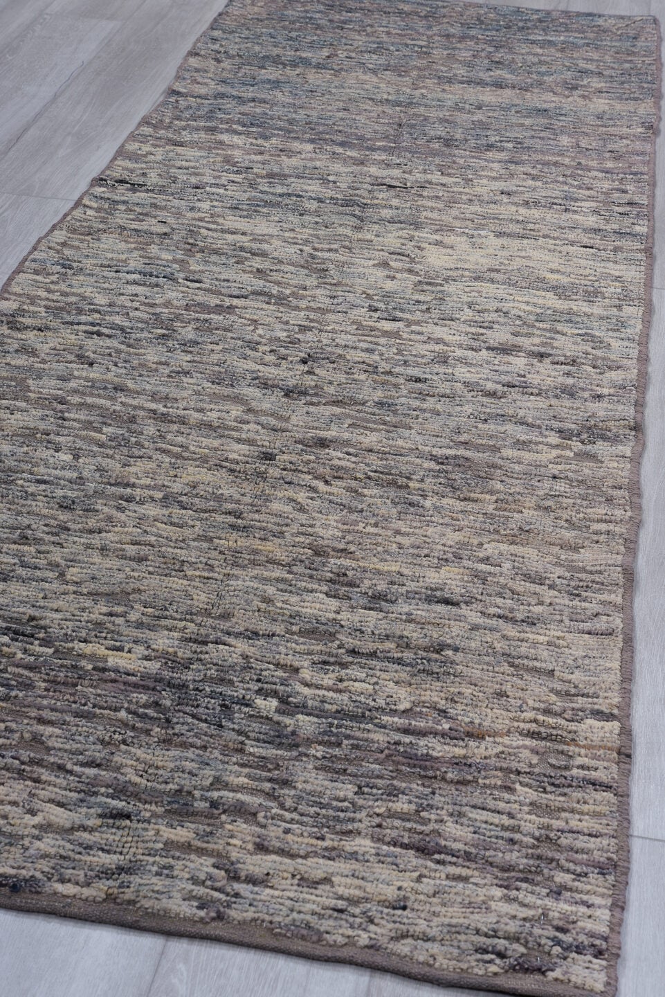 3' x 9' one-of-a-kind handmade vintage Tulu runner rug. Color palette: gray, taupe, charcoal, ivory, beige, black