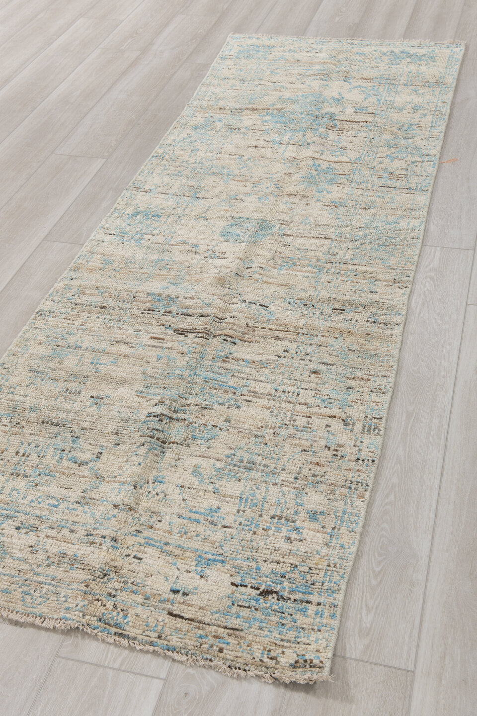2' x 8' one-of-a-kind handmade vintage Tulu runner rug. Color palette: ivory, pale blue, sky blue, taupe, gray, light blue