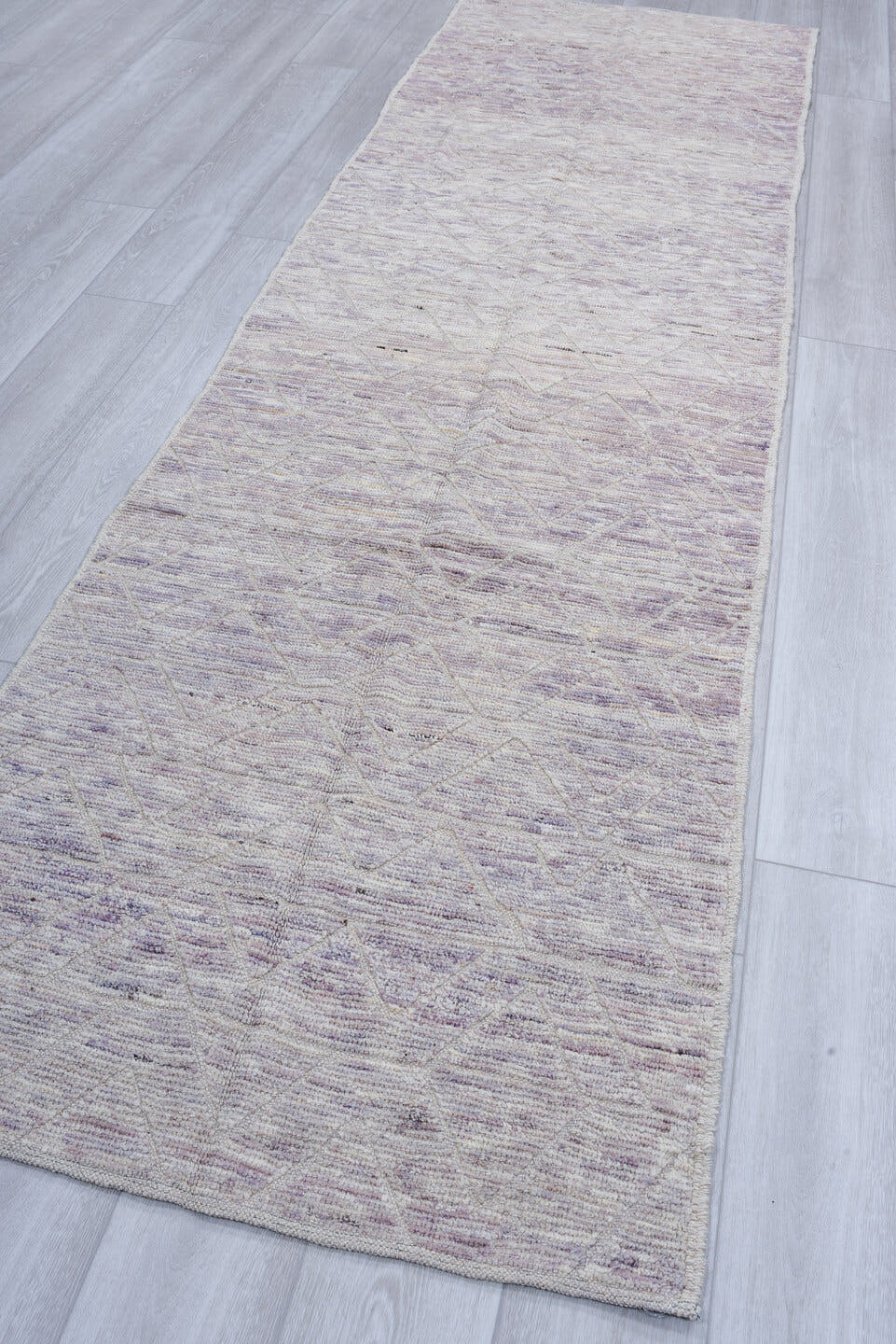 3' x 11' one-of-a-kind handmade vintage Tulu runner rug. Color palette: ivory, taupe, lavender, gray, greige, beige