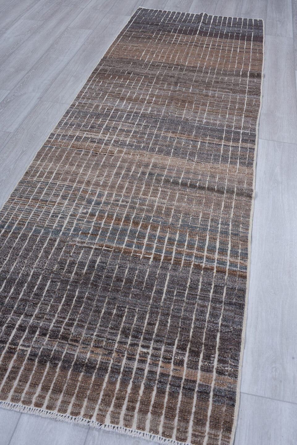 3' x 9' one-of-a-kind handmade vintage Tulu runner rug. Color palette: taupe, charcoal, ivory, slate, brown, gray, beige