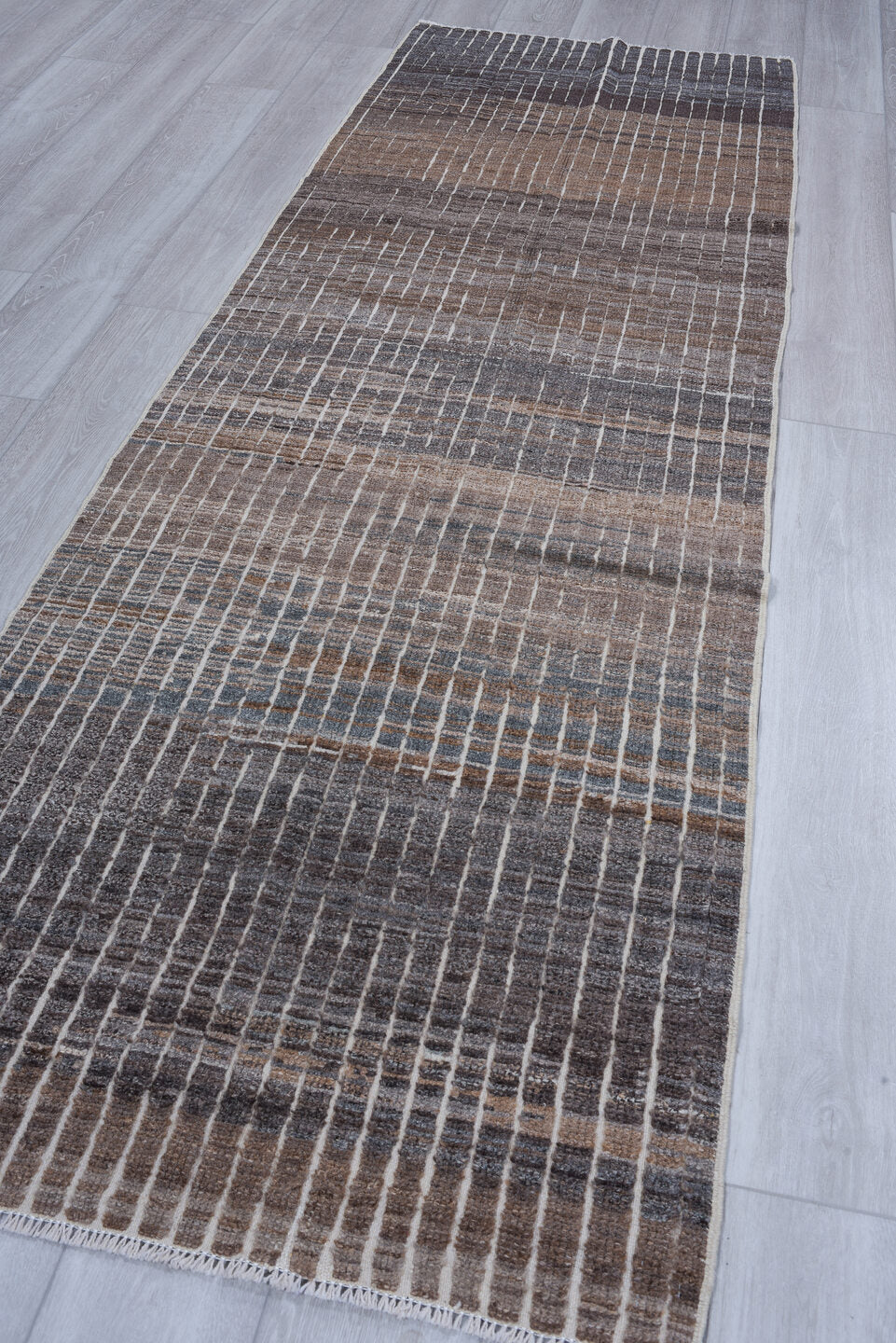 3' x 9' one-of-a-kind handmade vintage Tulu runner rug. Color palette: taupe, charcoal, ivory, slate, brown, gray, beige