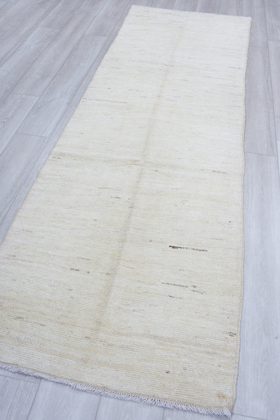 3' x 9' one-of-a-kind handmade vintage Tulu runner rug. Color palette: ivory, cream, beige, taupe, camel, gray