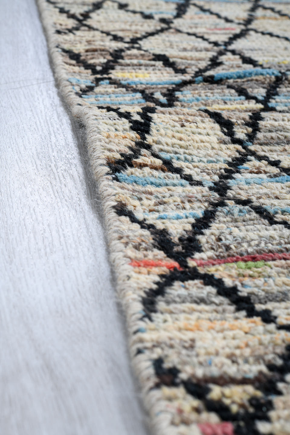 2' x 9' one-of-a-kind handmade vintage Tulu runner rug. Color palette: ivory, charcoal, slate, pale blue, rose, saffron