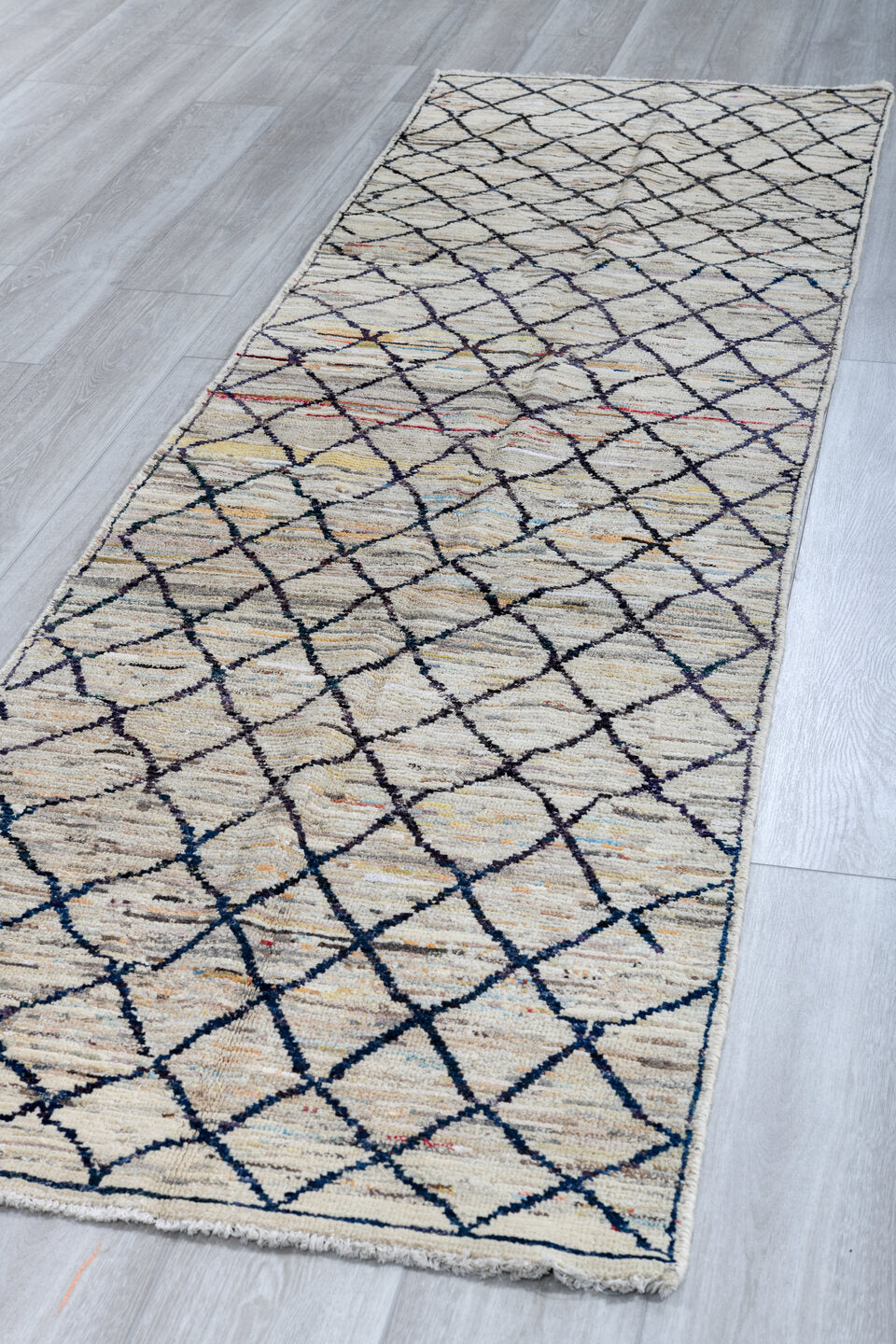2' x 10' one-of-a-kind handmade vintage Tulu runner rug. Color palette: ivory, charcoal, taupe, camel, faded red, slate