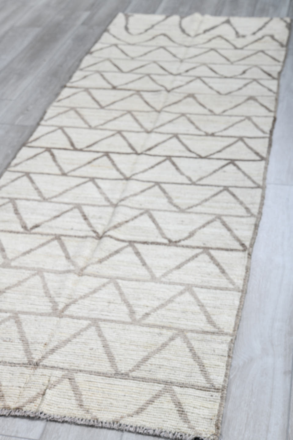 3' x 9' one-of-a-kind handmade vintage Tulu runner rug. Color palette: ivory, taupe, gray, beige