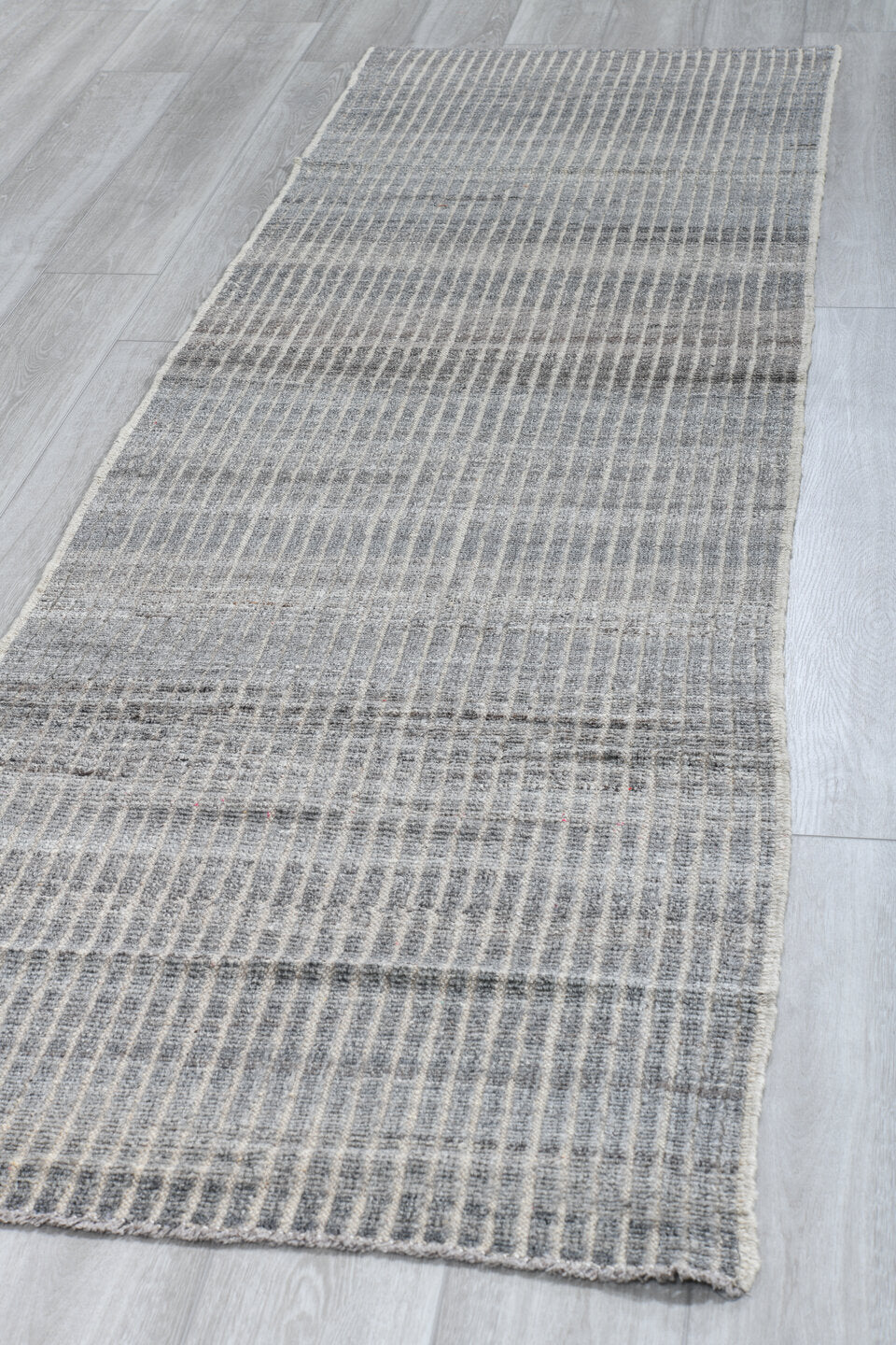 2' x 9' one-of-a-kind handmade vintage Tulu runner rug. Color palette: ivory, slate, gray, charcoal, black