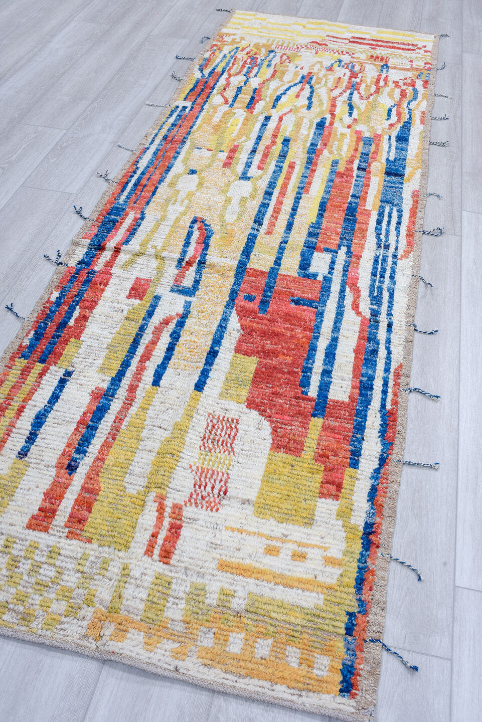 3' x 9' one-of-a-kind handmade vintage Tulu runner rug. Color palette: ivory, red, blue, gold, camel, beige
