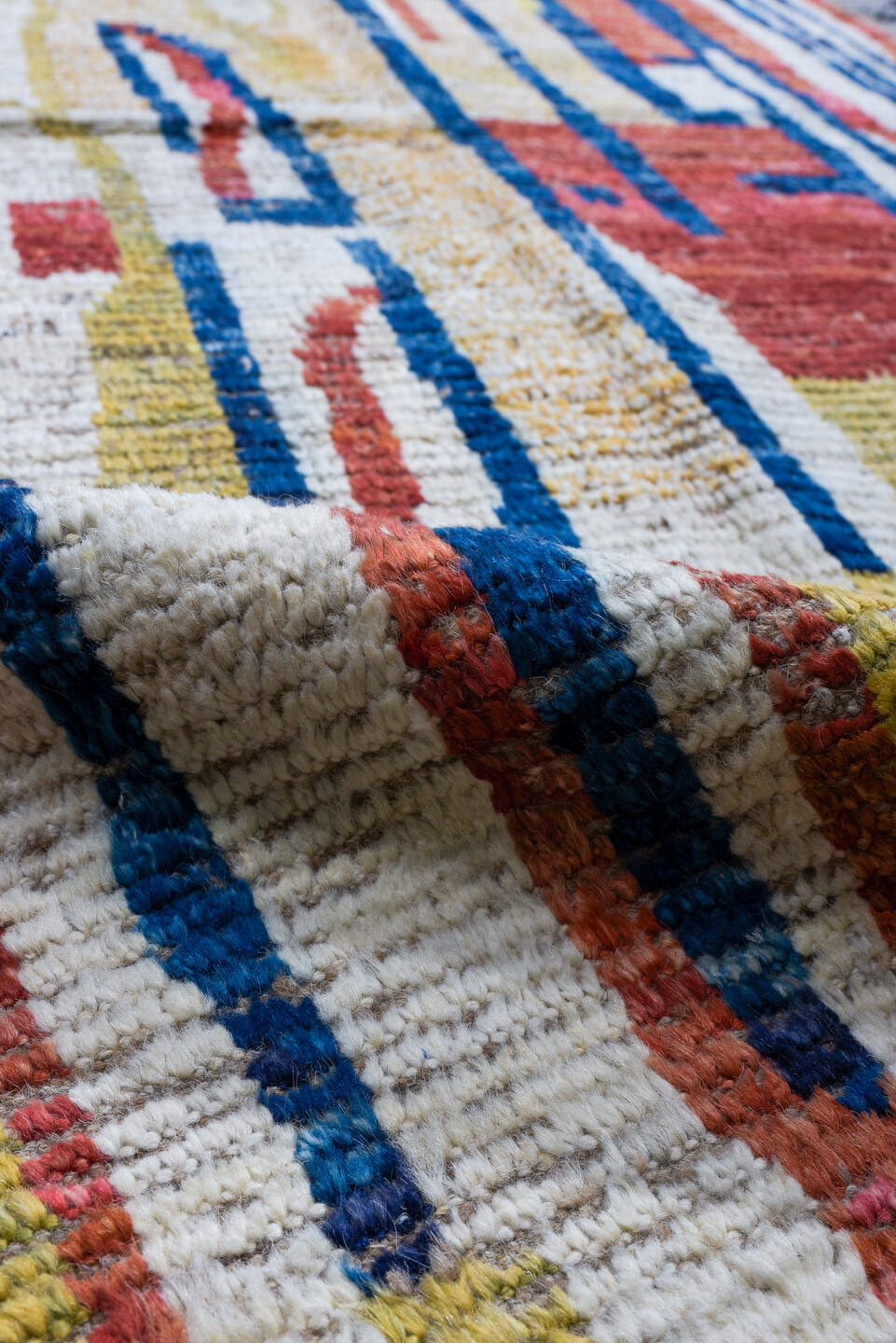 3' x 9' one-of-a-kind handmade vintage Tulu runner rug. Color palette: ivory, red, blue, gold, camel, beige