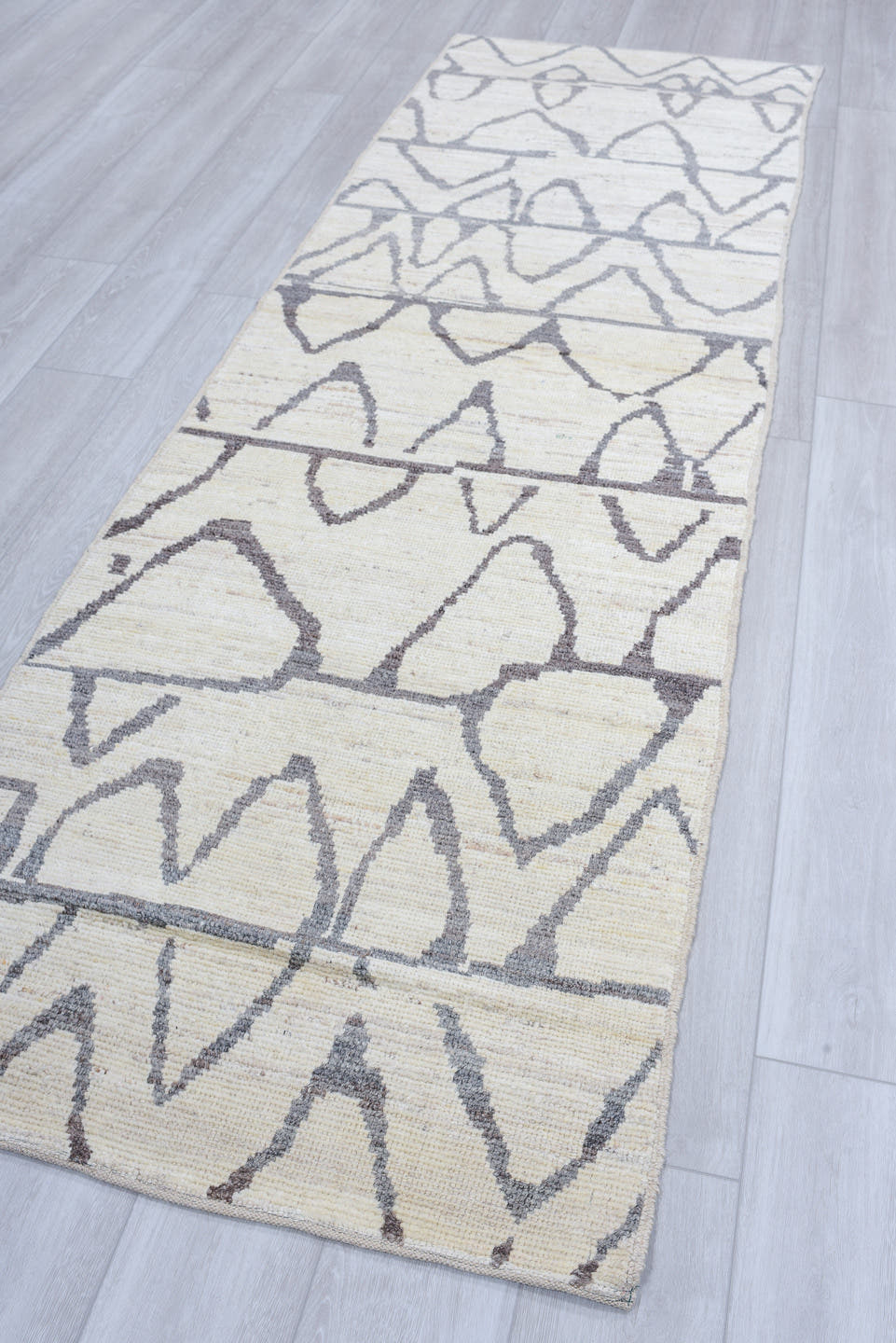 3' x 9' one-of-a-kind handmade vintage Tulu runner rug. Color palette: ivory, charcoal, gray, black