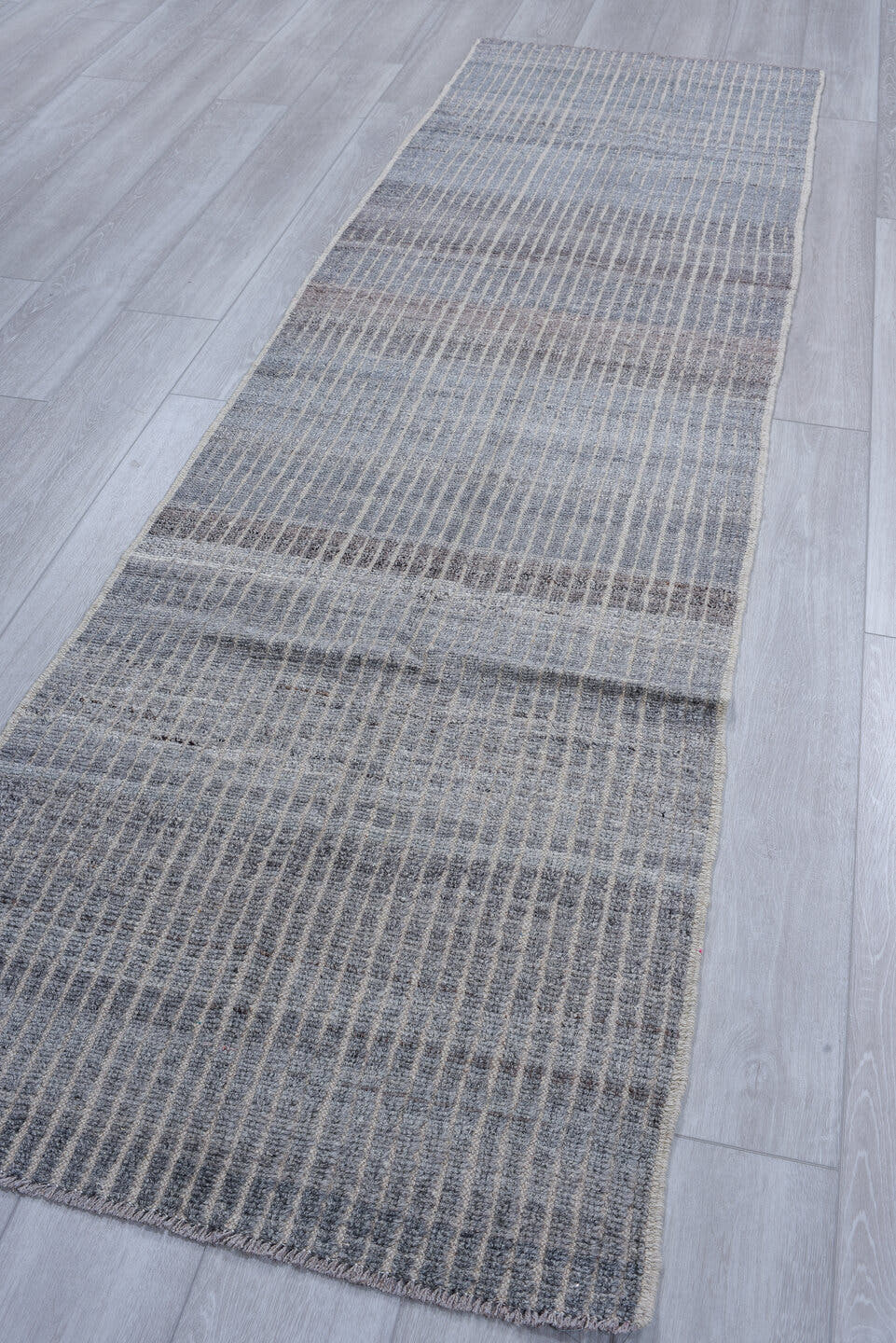 2' x 9' one-of-a-kind handmade vintage Tulu runner rug. Color palette: gray, ivory, charcoal, slate, black
