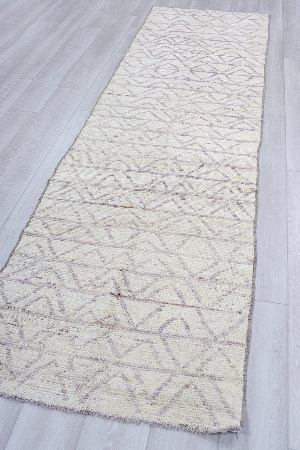 3' x 10' one-of-a-kind handmade vintage Tulu runner rug. Color palette: ivory, taupe, gray, cream, beige