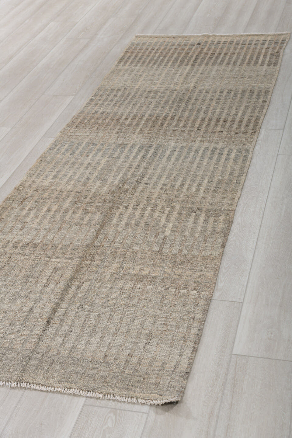 3' x 9' one-of-a-kind handmade vintage Tulu runner rug. Color palette: ivory, taupe, gray, charcoal, beige, black