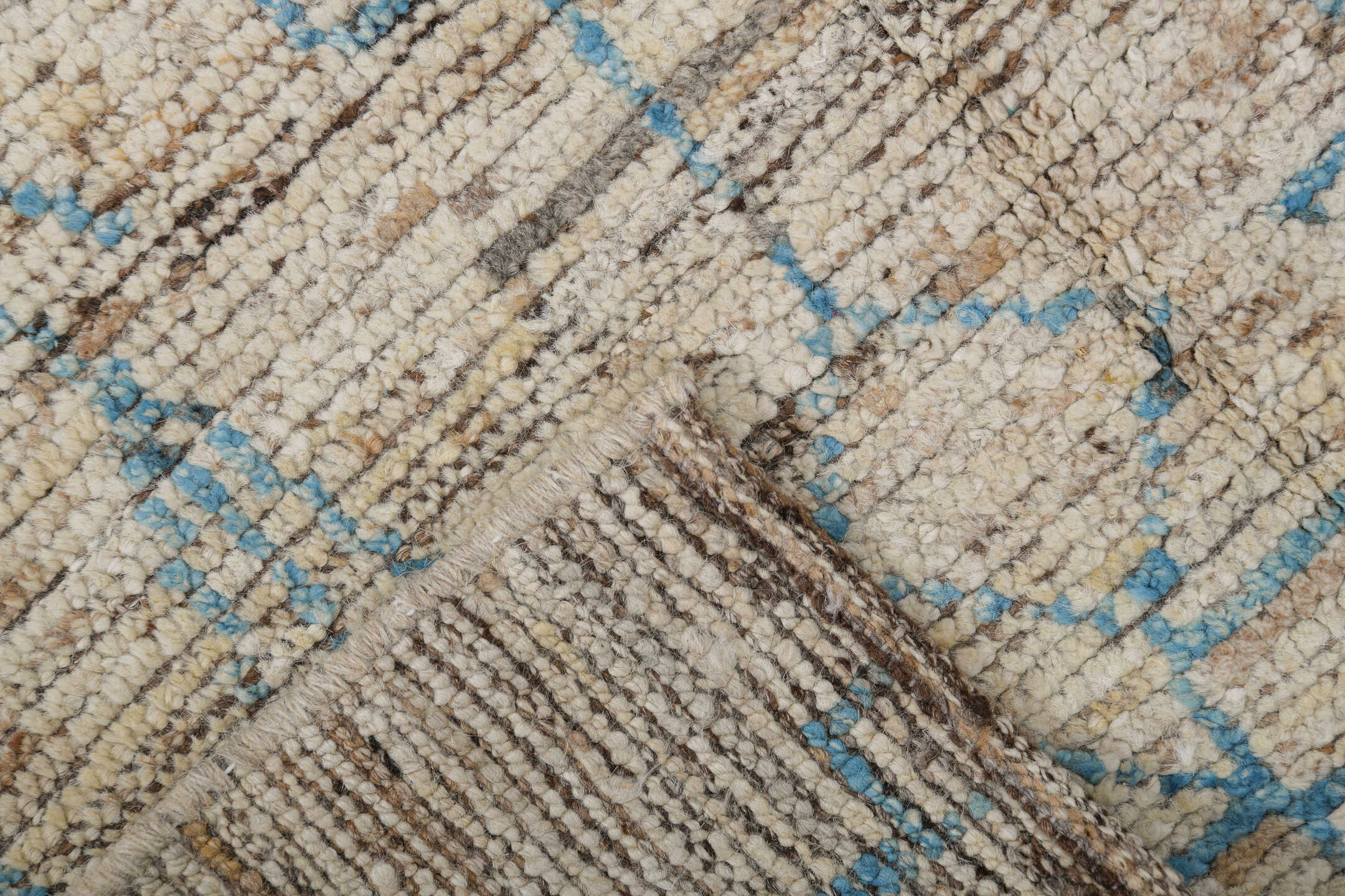 3' x 8' one-of-a-kind handmade vintage Tulu runner rug. Color palette: ivory, sky blue, taupe, brown, cream, light blue