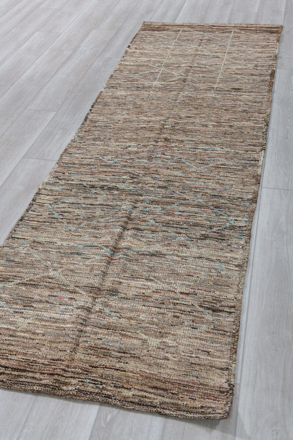 3' x 10' one-of-a-kind handmade vintage Tulu runner rug. Color palette: taupe, ivory, brown, camel, pale blue, beige, gray