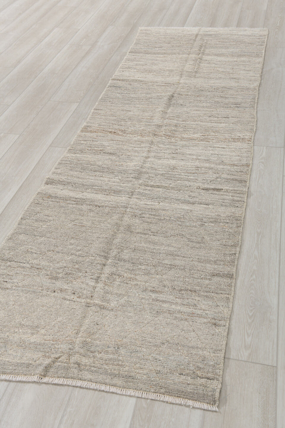 2' x 9' one-of-a-kind handmade vintage Tulu runner rug. Color palette: ivory, taupe, cream, beige, gray