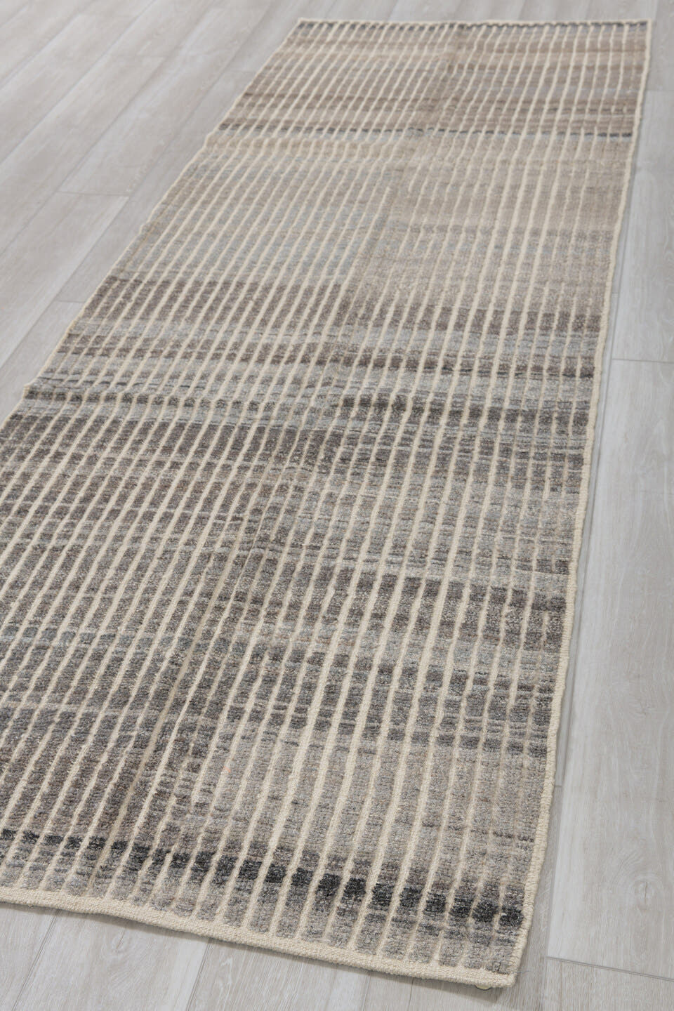 3' x 9' one-of-a-kind handmade vintage Tulu runner rug. Color palette: ivory, charcoal, gray, taupe, black, beige