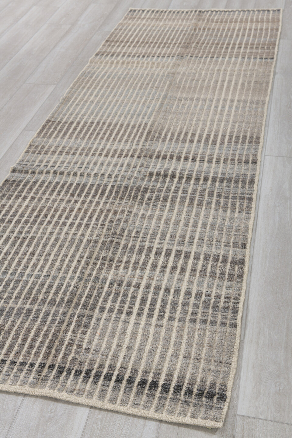 3' x 9' one-of-a-kind handmade vintage Tulu runner rug. Color palette: ivory, charcoal, gray, taupe, black, beige