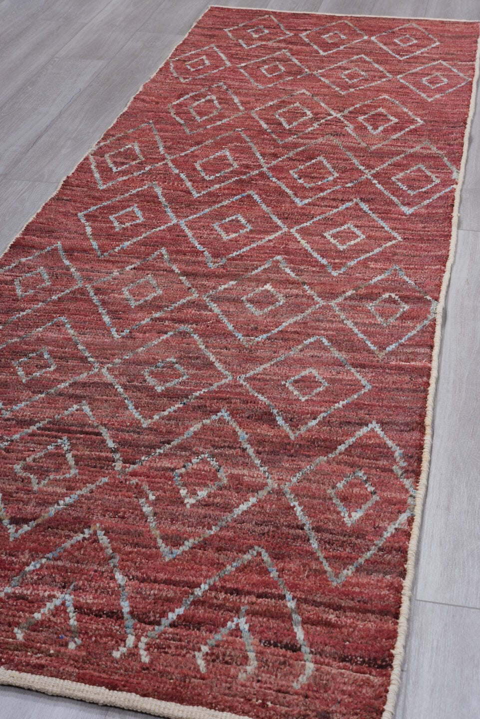3' x 10' one-of-a-kind handmade vintage Tulu runner rug. Color palette: rose, terracotta, ivory, crimson, taupe, pink, red