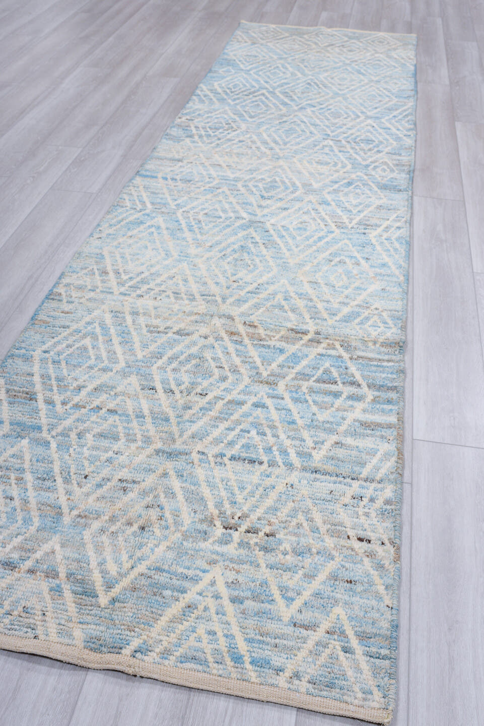 3' x 12' one-of-a-kind handmade vintage Tulu runner rug. Color palette: sky blue, ivory, light gray, taupe, light blue