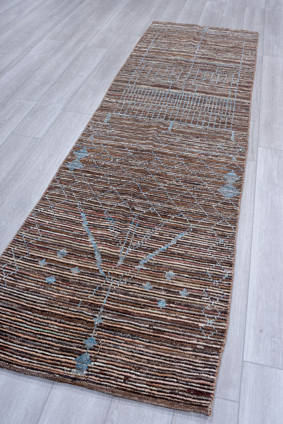 2' x 10' one-of-a-kind handmade vintage Tulu runner rug. Color palette: brown, sky blue, ivory, charcoal, light blue, gray