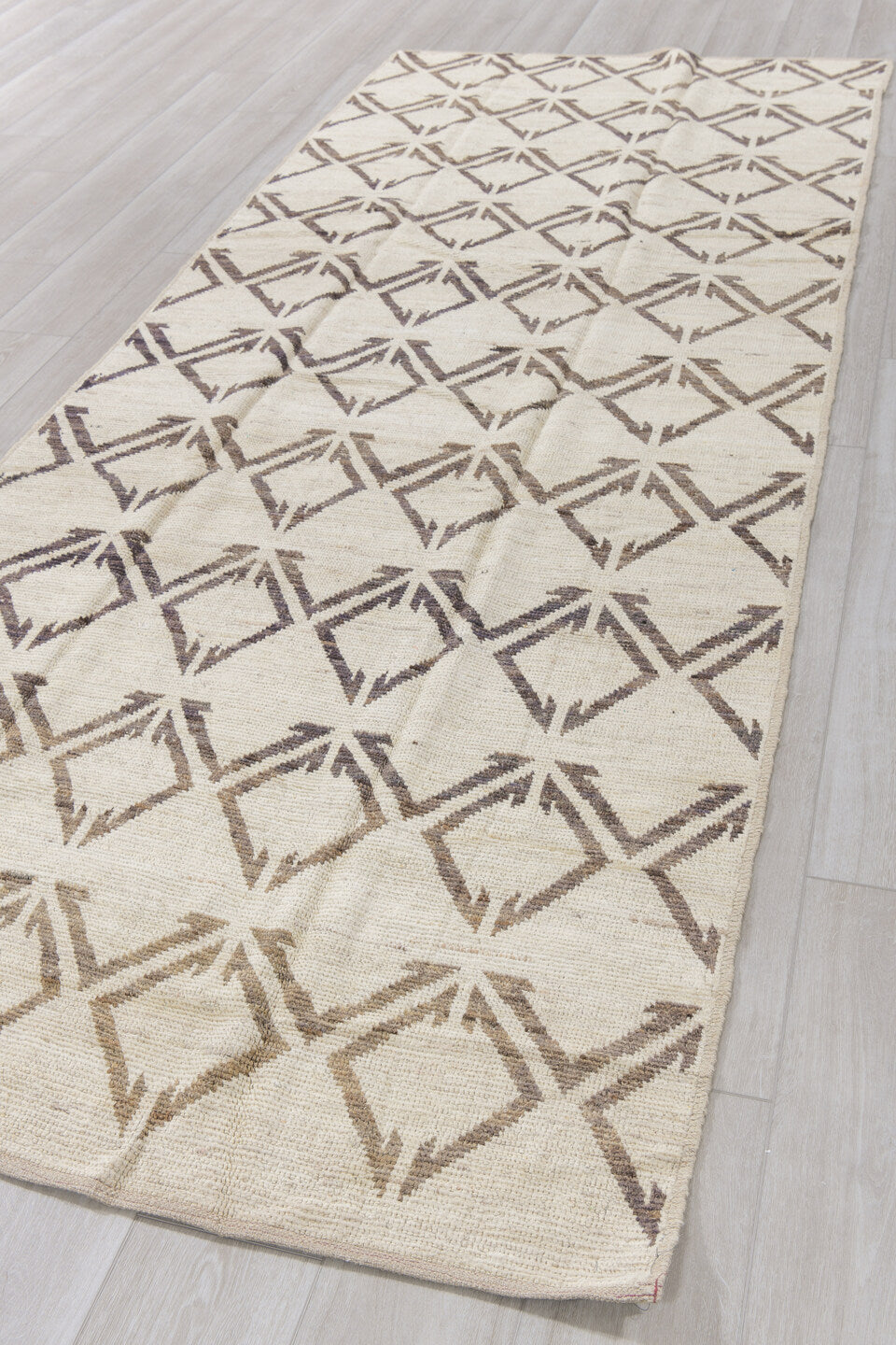 4' x 11' one-of-a-kind handmade vintage Tulu runner rug. Color palette: ivory, charcoal, taupe, black, gray, beige