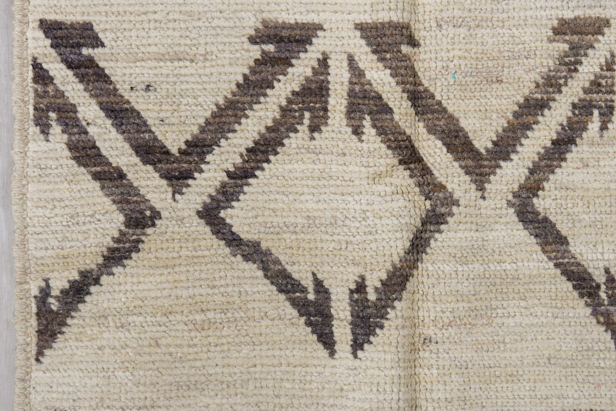 4' x 11' one-of-a-kind handmade vintage Tulu runner rug. Color palette: ivory, charcoal, taupe, black, gray, beige