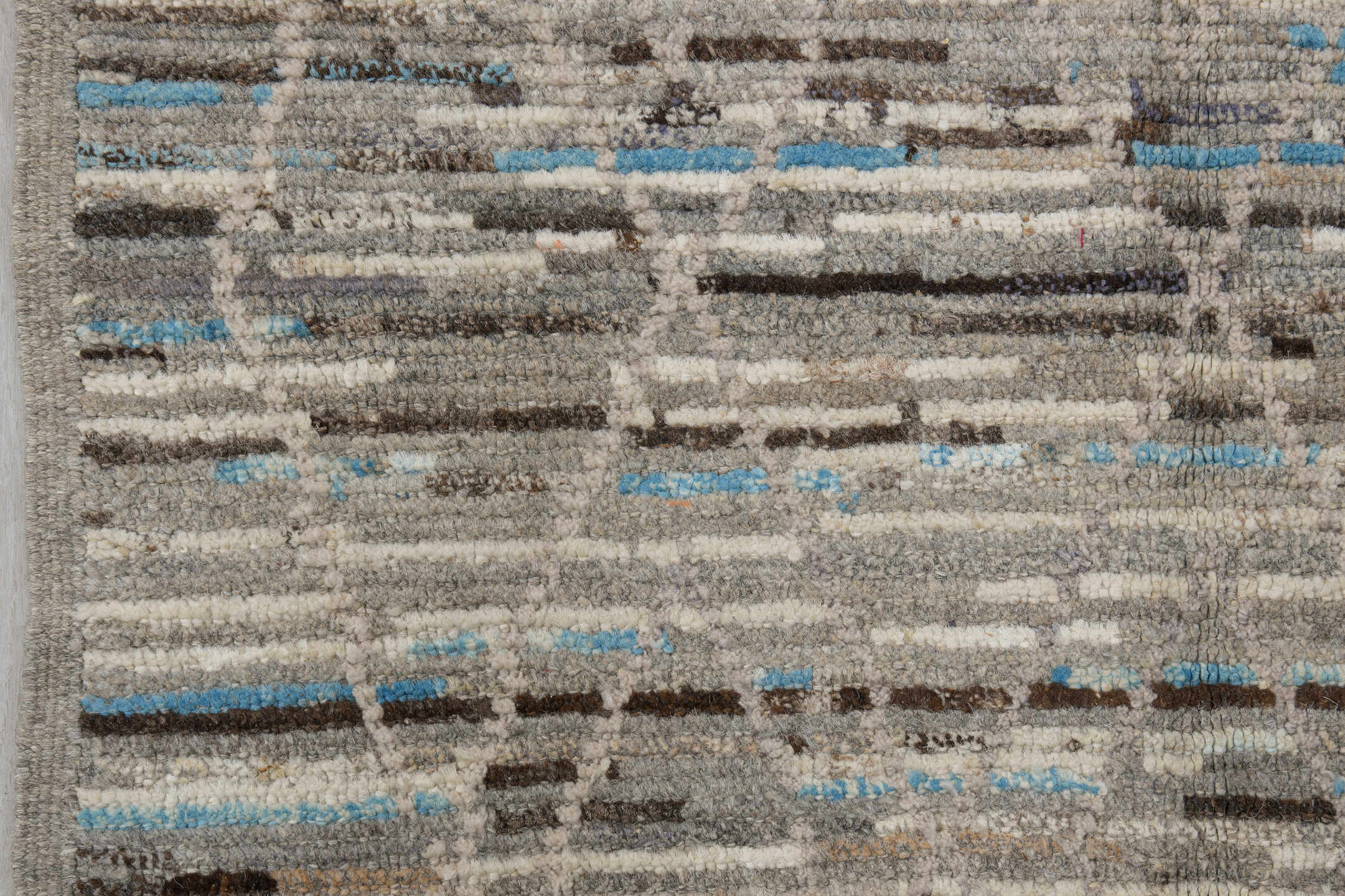 3' x 12' one-of-a-kind handmade vintage Tulu runner rug. Color palette: gray, ivory, taupe, charcoal, sky blue, brown, beige