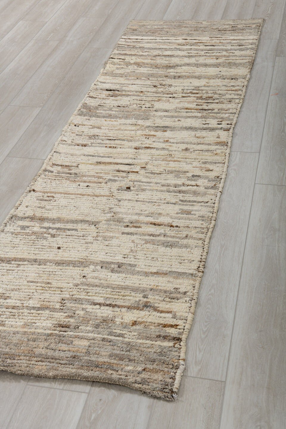 2' x 9' one-of-a-kind handmade vintage Tulu runner rug. Color palette: ivory, taupe, charcoal, brown, cream, gray, beige