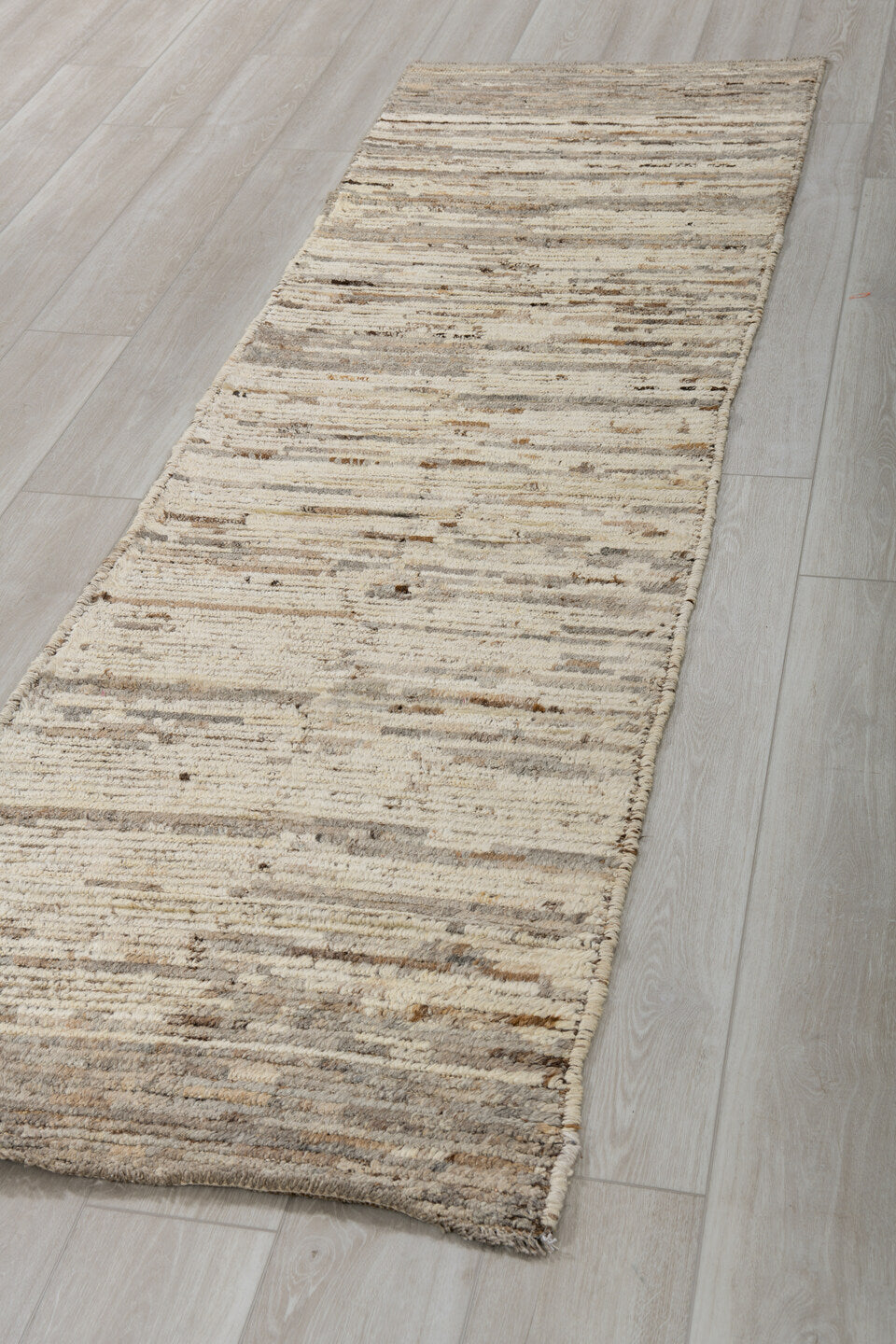 2' x 9' one-of-a-kind handmade vintage Tulu runner rug. Color palette: ivory, taupe, charcoal, brown, cream, gray, beige