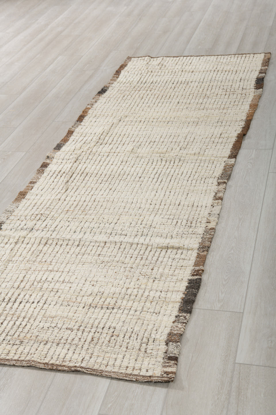 3' x 9' one-of-a-kind handmade vintage Tulu runner rug. Color palette: ivory, brown, taupe, charcoal, beige, gray, black