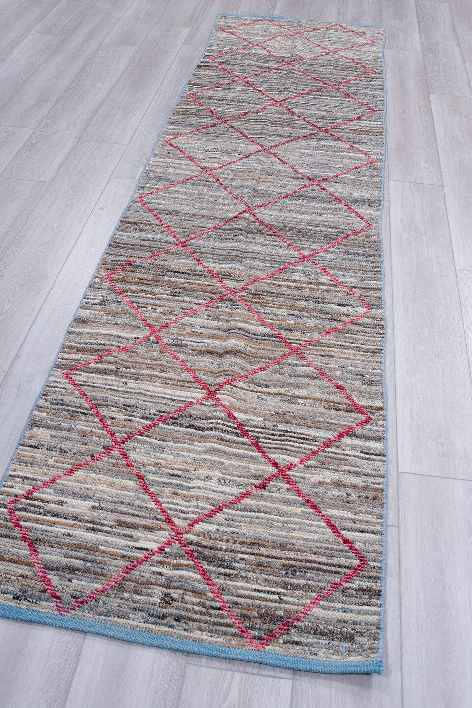 2' x 10' one-of-a-kind handmade vintage Tulu runner rug. Color palette: gray, ivory, raspberry, taupe, charcoal, sky_blue