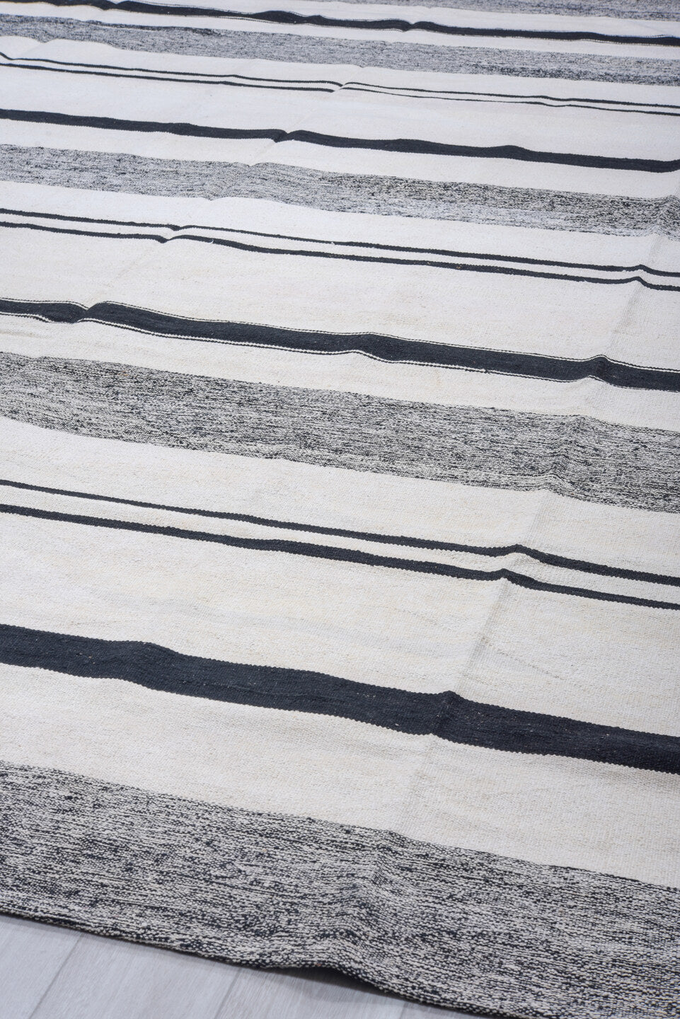 11' x 15' one-of-a-kind handmade vintage Tulu oversize rug. Color palette: ivory, charcoal, black, gray