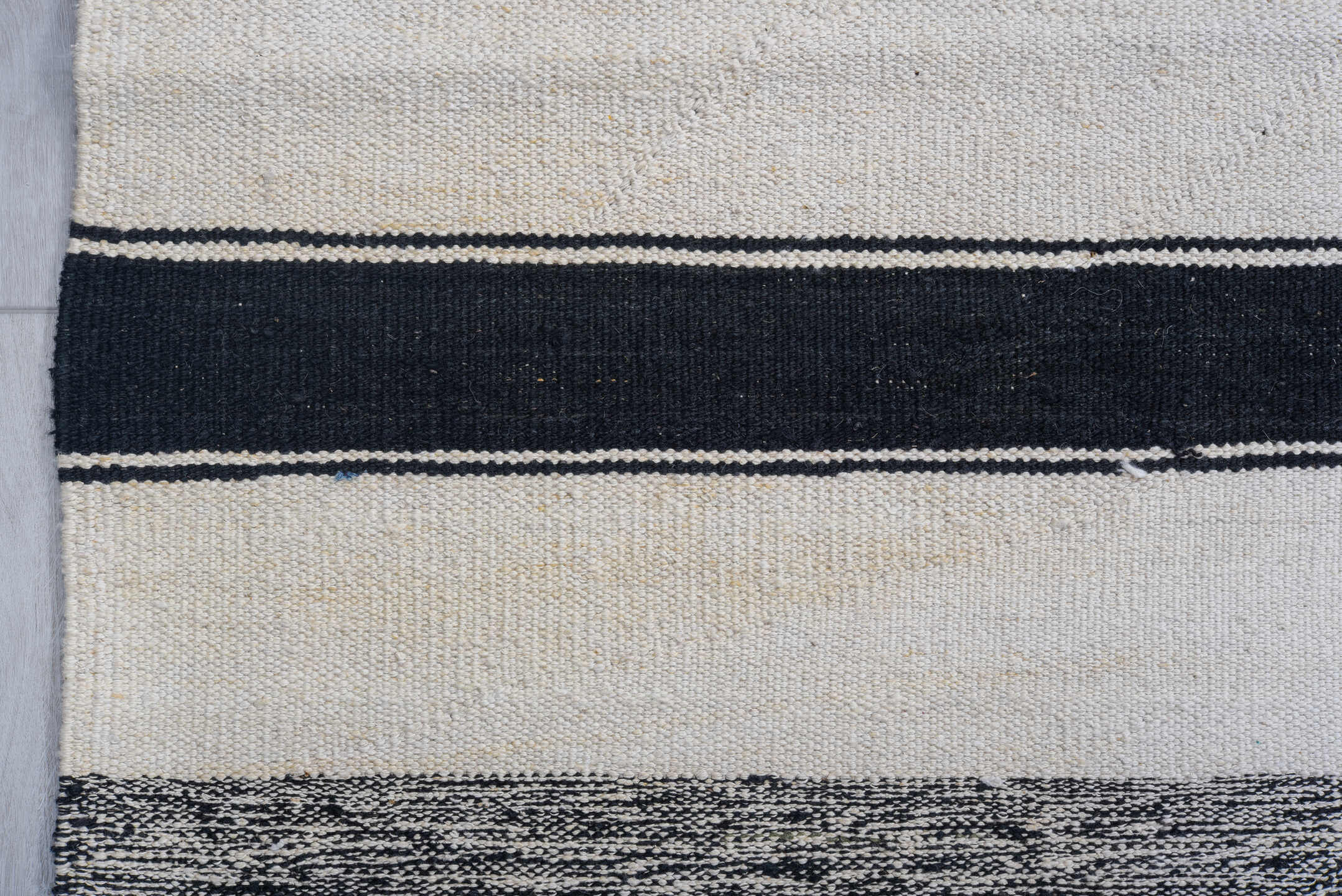 11' x 15' one-of-a-kind handmade vintage Tulu oversize rug. Color palette: ivory, charcoal, black, gray
